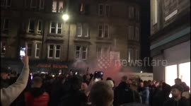 Hearts fans chanting with a set off flare before Edinburgh Derby against Hibernian FC. Easter road