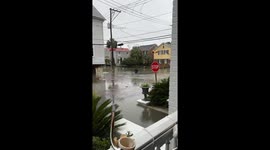 Fully Suited Man Wades Through Floodwater