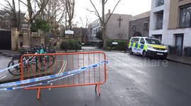 Police remain outside London Oratory School in Fulham with fire investigation underway