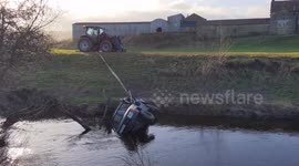 Three men killed when car was trapped in flooded river