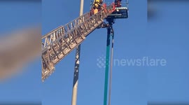 Firefighters Save Electrical Worker Trapped 80 Feet Above Ground in Montgomery, USA
