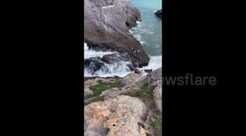 Man Almost Swept into the Sea by Big Waves in Fuding, China
