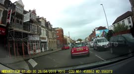Cyclist fail. Cyclist lands a jump on busy road and ends up flying over the handlebars, narrowly missing cars in Bristol UK