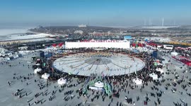 Winter fishing on frozen lake attracts tourists to NE China