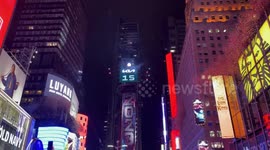 New Year’s Eve: Times Square Ball drops at midnight as confetti falls, a couple kisses