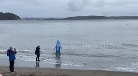 Brave swimmers take to the water for traditional New Year’s Day sea swim in Cawsand, Cornwall