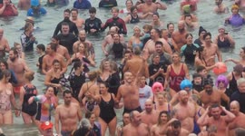 Charity swim held in Newquay Harbour, Cornwall for New Year's Day 2024