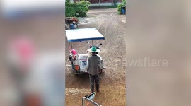 Excited pet dogs hop on motorcycle sidecar for road trip with their owner