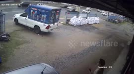Pickup truck spins out of control and drags motorcycle rider across road