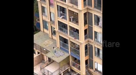 Brave neighbours unit to save toddler in terrifying balcony dangle in China