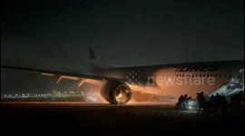 Passengers flee Japan plane crash fire