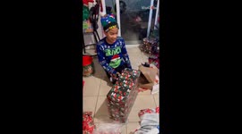 Uncontainable excitement surges through boy when he finally gets his hands on PS5