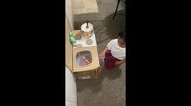 Girl Gets Cookin' in Cardboard Kitchen