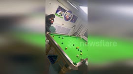 Man accidentally snags flying pool ball in noodle bowl