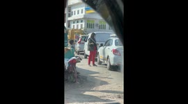 Kind woman feeds dog stuck in hot car in India