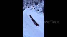 Chinese tourists experience mountain 'Snake' adventure on thrilling tubes