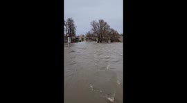 Regensburg's Stone Bridge battling raging flood waters