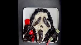 Timelapse video of Ghostface from Scream food art made using sushi rice and other ingredients