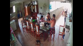 Sneaky toddler pulls away chair, dad falls flat on backside