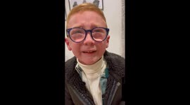 Boy gets surprised, overly emotional by slew of gifts from Santa