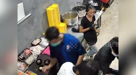 Cook saves colleague with burning hair at hotpot restaurant