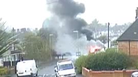 CCTV: Robbers use stolen van to ram open stolen cash box, then set van on fire.