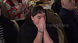 Fans react to Luke Littler's loss in the PDC World Championship final in Saint Helens, UK