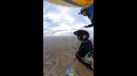 Diver dangerously jumps from balloon into parachute during heart-stopping incident