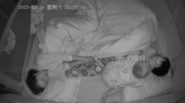 Baby hilariously slaps snoring dad in middle of the night