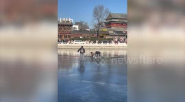 Seven people fall into frozen river trying to save drowning child