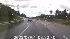 Car spins out of control on wet road in Thailand