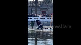 Good Samaritans unit to rescue father and son trapped in frozen water in China
