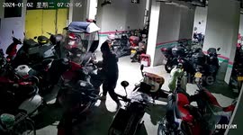 Chinese woman in bad mood topples scooters at garage