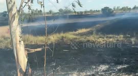 Thick smoke covers roads as farmers burn fields to clear crops in Thailand