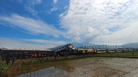 Rescue teams inspect twisted wreckage of deadly train crash in Indonesia