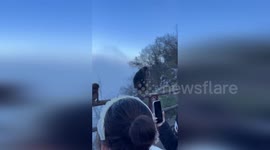 Two macaques share kiss in front of delighted crowd