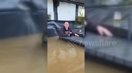 Pub owner enjoys pint in waist-high flood water in Worcester