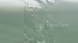 Military Police Eagle Rescues Drowning Bather on Guaruja Beach in Brazil