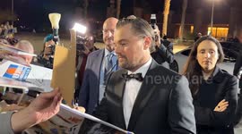Leonardo DiCaprio signs autographs for screaming fans at Palm Springs International Film Festival