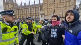 Ceasefire now!: protesters attempt to break through police cordon imposed on them in Westminster