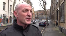 London Fire Brigade spokesman and cafe owner speak to the media following flooding in Hackney, London, UK