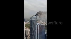 Fire erupts on roof deck on high-rise in the Philippines