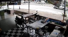 Monkey thief stealthily enters shop and eats food left on table