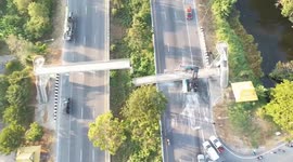 Trailer truck knocks down footbridge causing traffic chaos on Thai highway