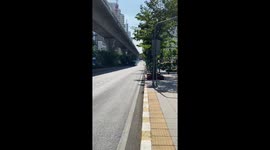 Bus belches thick clouds of exhaust fumes on road in Bangkok