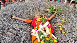 'Possessed' elderly woman dances on heap of thorns during bizarre Indian festival