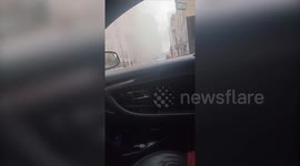 Video shows smoke and officer guiding woman away from scene after explosion in Fort Worth, Texas