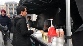 Buying food for lunch within Leather Lane, London, United Kingdom