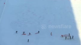 Locals create giant dragon mural on snow-covered field in China for New Year