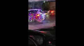 Car wrapped in fairy lights for Christmas